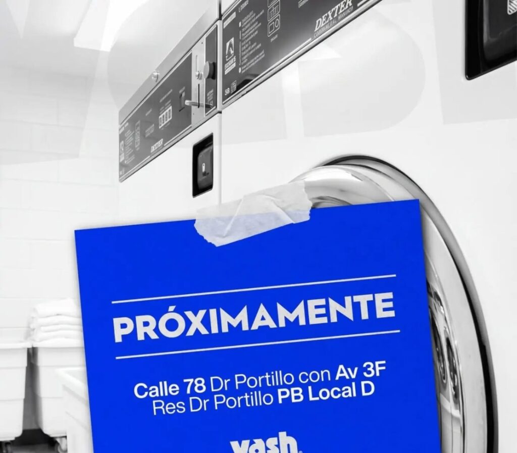 Cartel Próximamente de Vash sobre una lavadora industrial